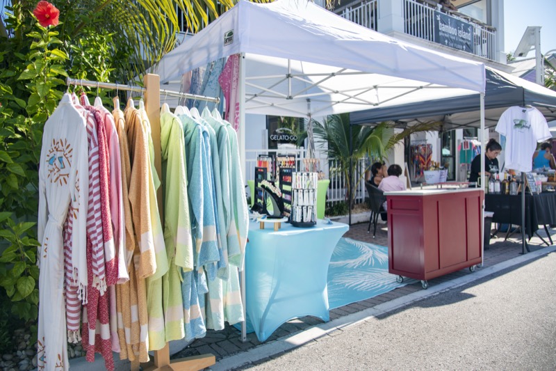 Clothing vendor booth with colorful apparel