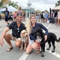 Couple with dogs enjoying Bridge Street