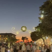 Crowds on Bridge Street under evening lights
