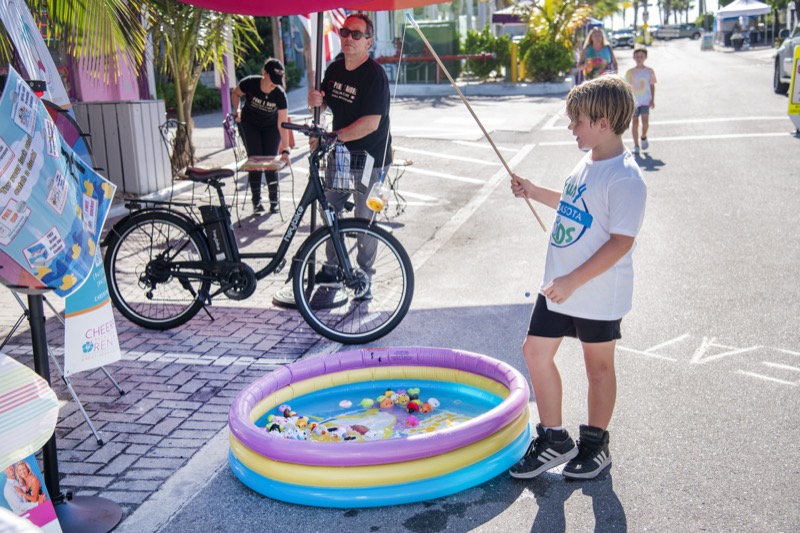 Boy fishing at a kiddie pool game